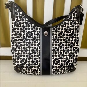 Black and white Coach tote bag and matching wallet.